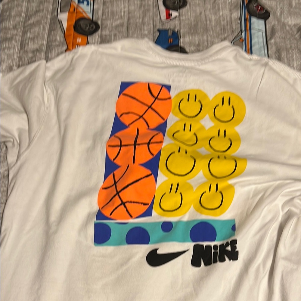 Nike White and Orange Short Sleeve Tee with Playful Graphic